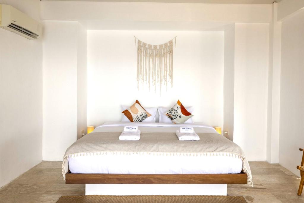 Postel nebo postele na pokoji v ubytování The AVA Resort Koh Tao