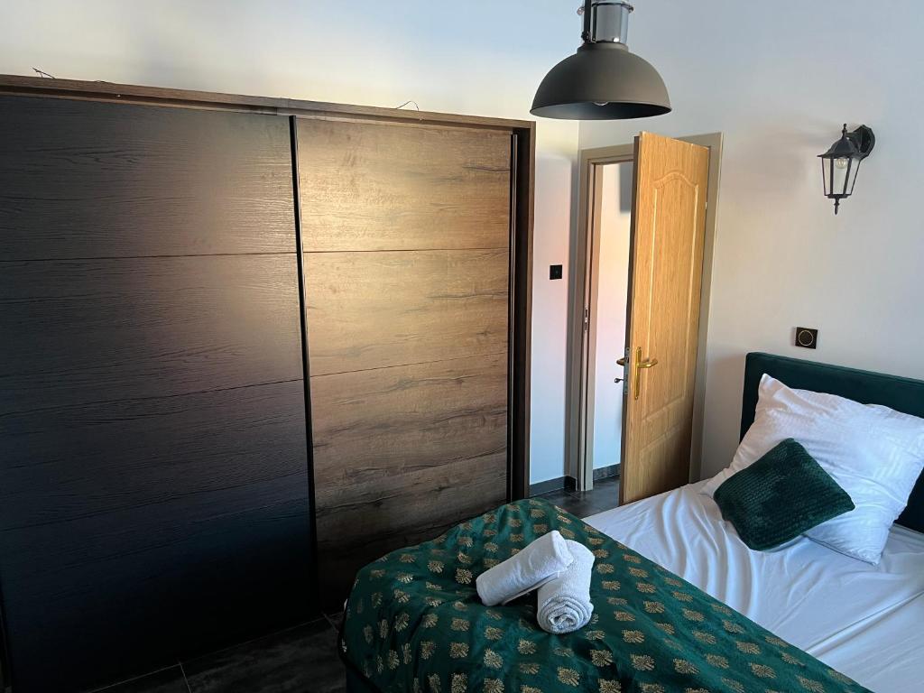 Posteľ alebo postele v izbe v ubytovaní Apartamenty Słowianka-BUTELKOWY