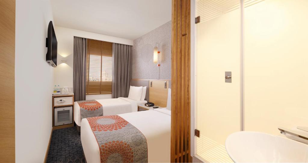 Postel nebo postele na pokoji v ubytování Holiday Inn Express Gurugram Sector 50 by IHG