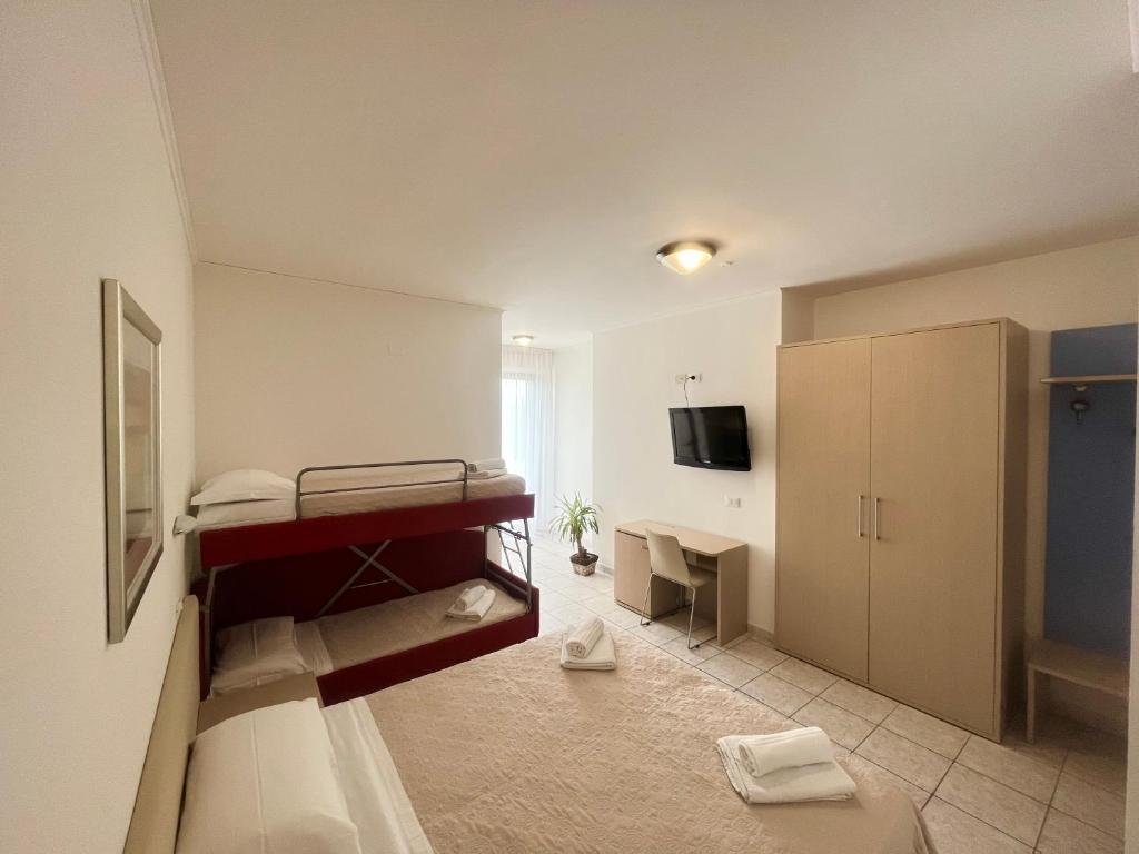 Postel nebo postele na pokoji v ubytování Hotel Rosen Garden