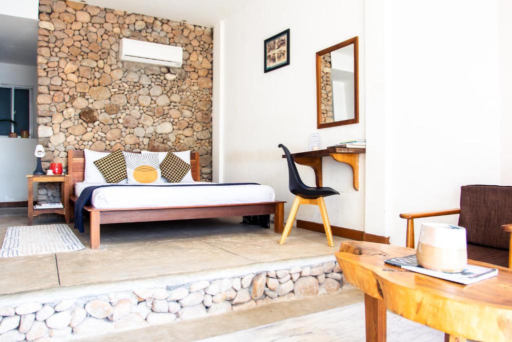 Postel nebo postele na pokoji v ubytování Saravoan-Kep Hotel