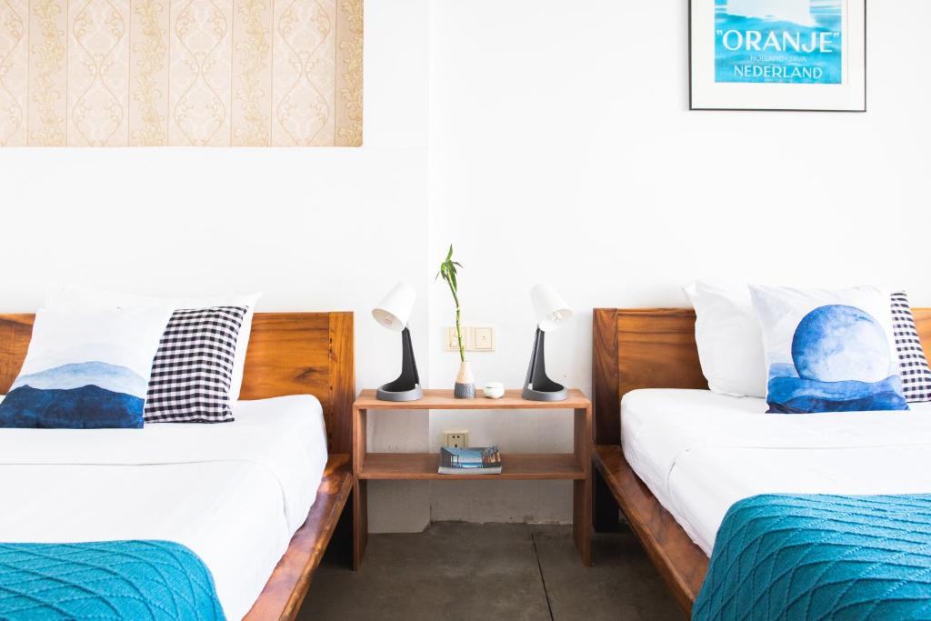 Postel nebo postele na pokoji v ubytování Saravoan-Kep Hotel