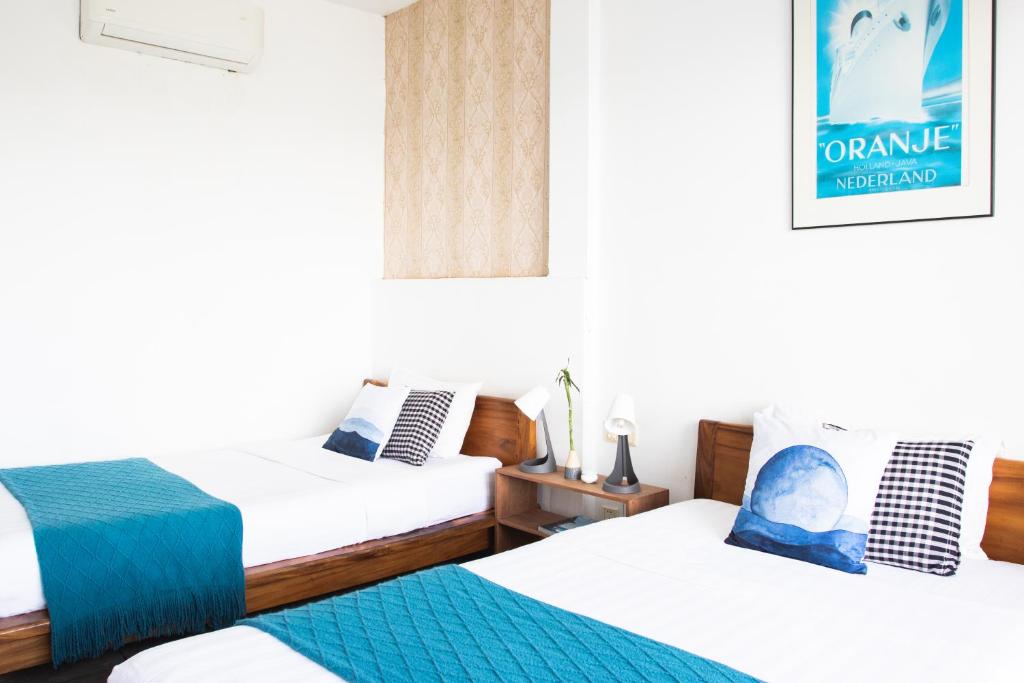Postel nebo postele na pokoji v ubytování Saravoan-Kep Hotel
