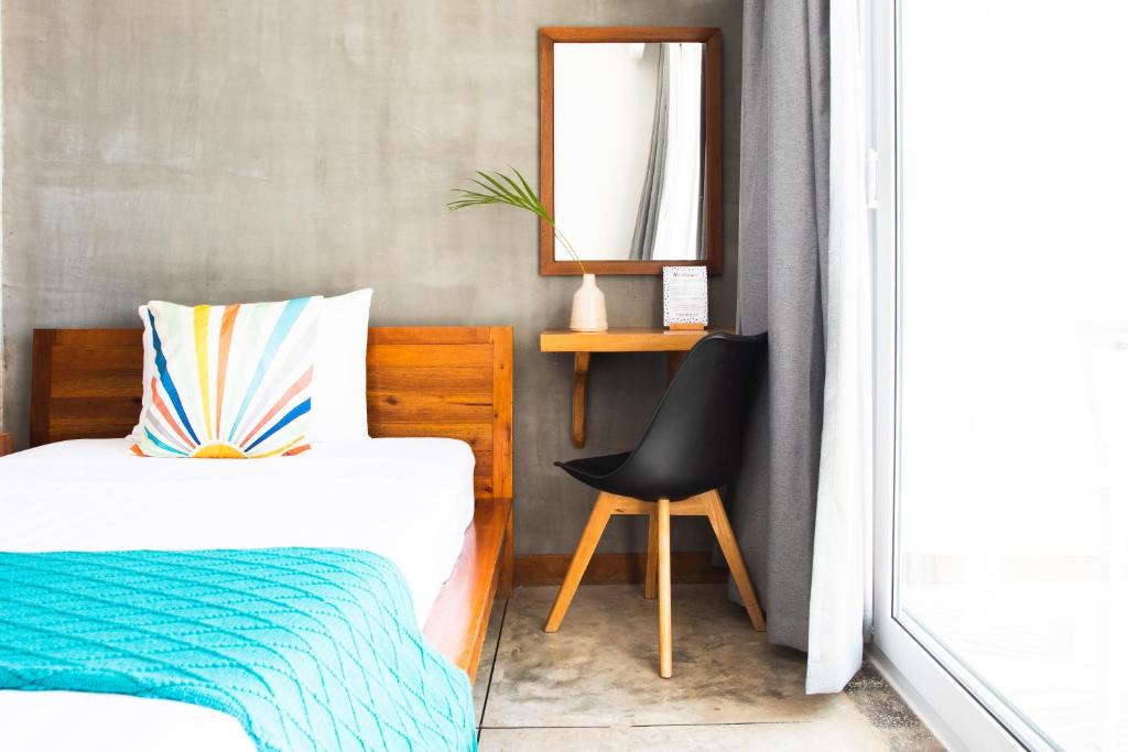 Postel nebo postele na pokoji v ubytování Saravoan-Kep Hotel