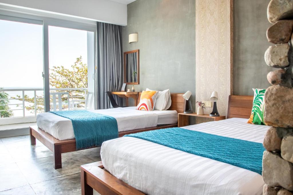 Postel nebo postele na pokoji v ubytování Saravoan-Kep Hotel