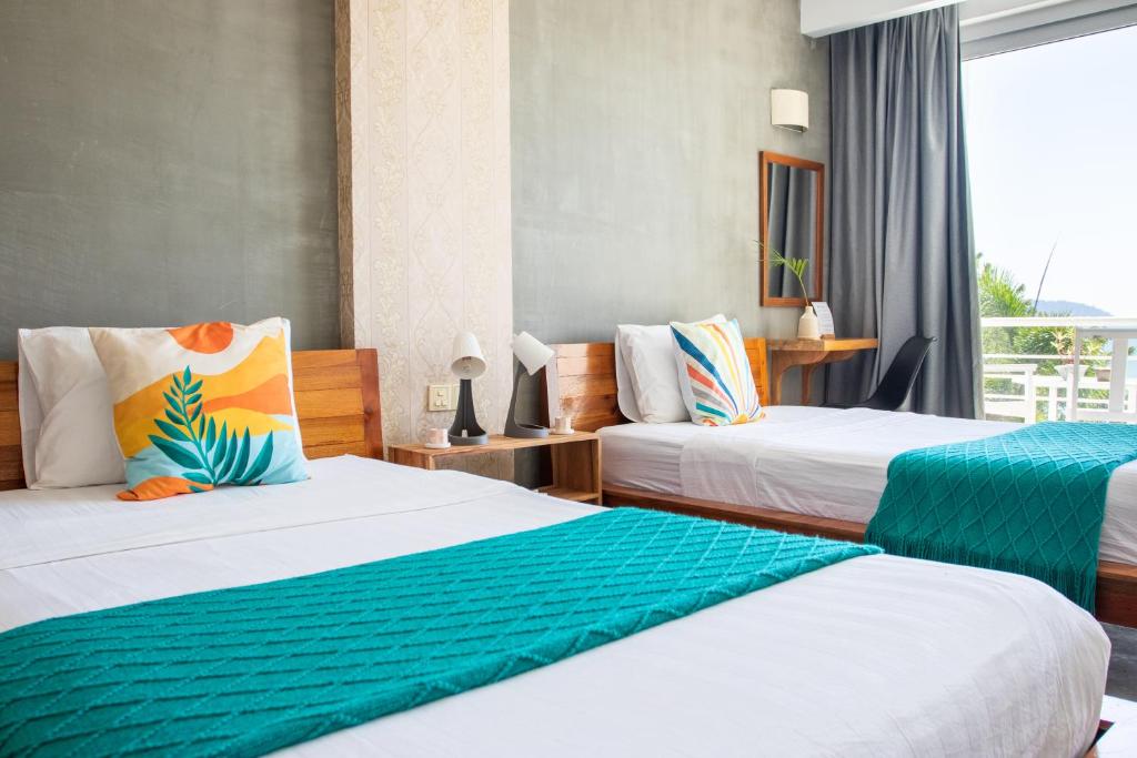 Postel nebo postele na pokoji v ubytování Saravoan-Kep Hotel