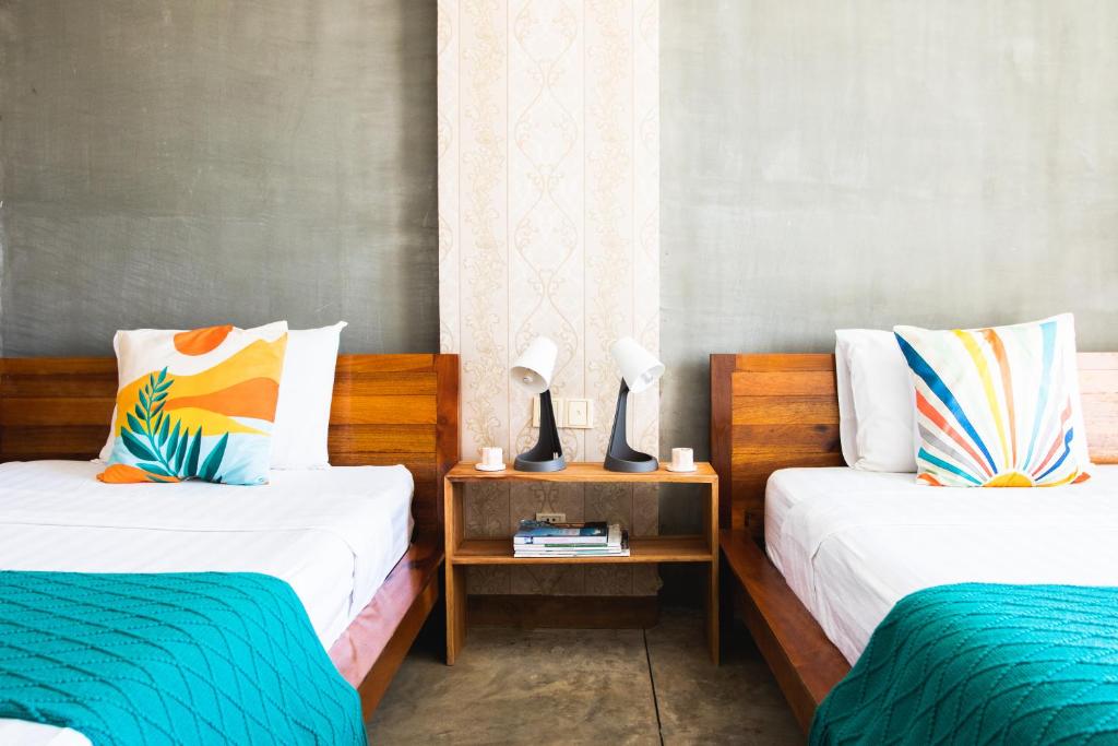 Postel nebo postele na pokoji v ubytování Saravoan-Kep Hotel