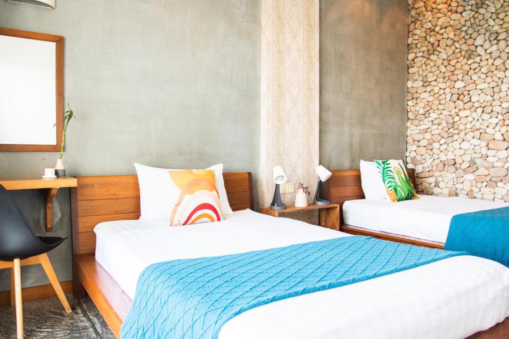 Postel nebo postele na pokoji v ubytování Saravoan-Kep Hotel