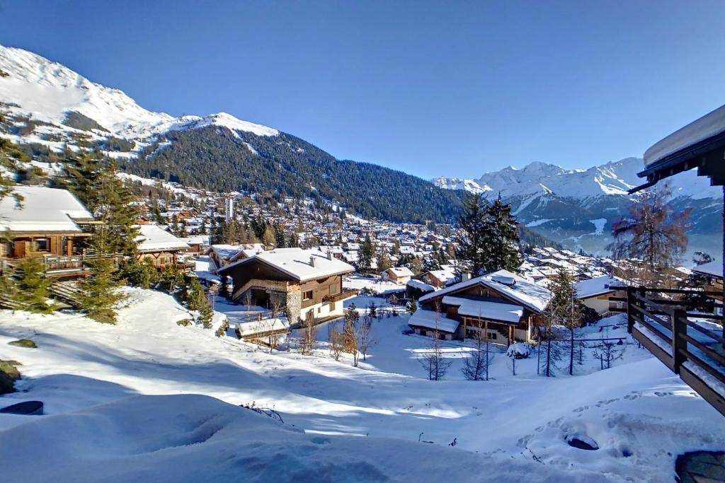 a village in the mountains covered in snow at Bocage 3 in Verbier