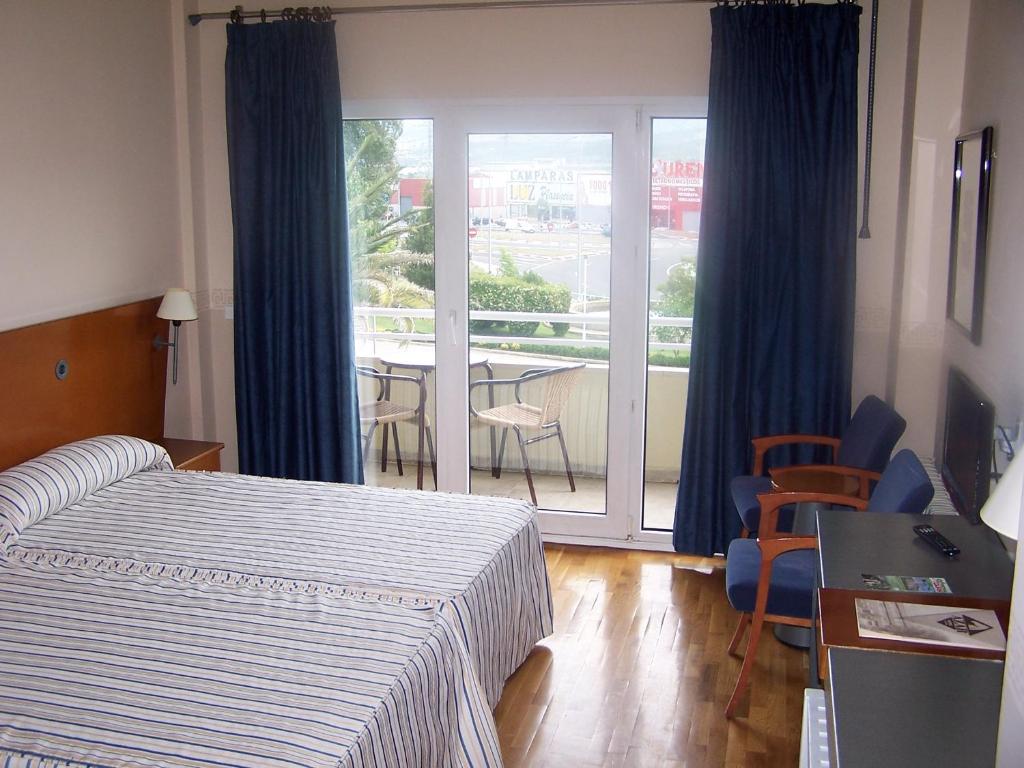 Postel nebo postele na pokoji v ubytování Hotel Azar