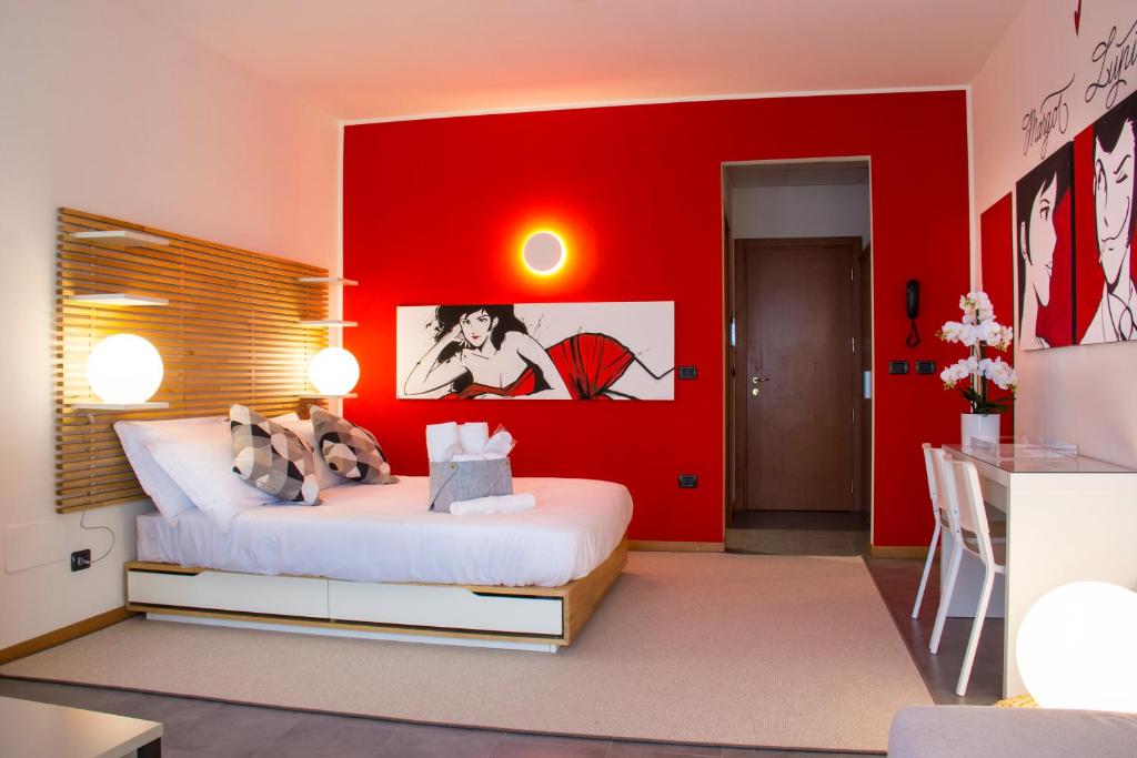 Postel nebo postele na pokoji v ubytování Hotel Borgo Brianteo