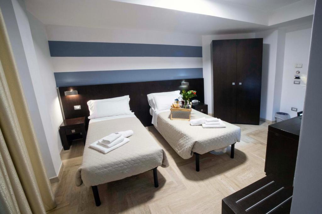 Postel nebo postele na pokoji v ubytování Albergo Cantiani