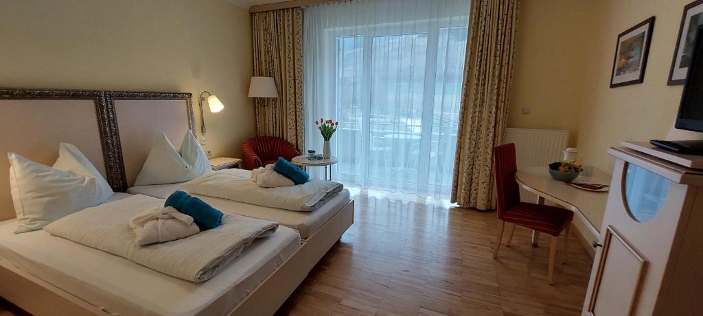 Postel nebo postele na pokoji v ubytování Gesundheits- & Wellness Resort Weissenbach