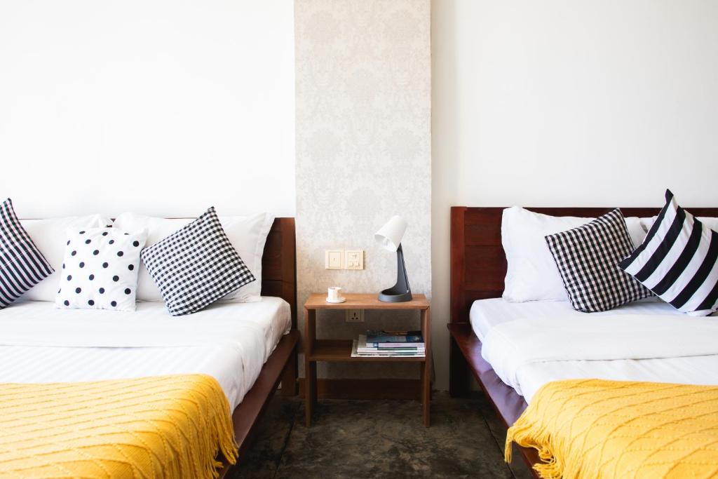 Postel nebo postele na pokoji v ubytování Saravoan-Kep Hotel
