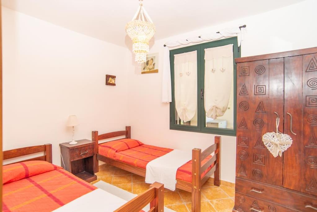 Postel nebo postele na pokoji v ubytování Villa Biderrosa