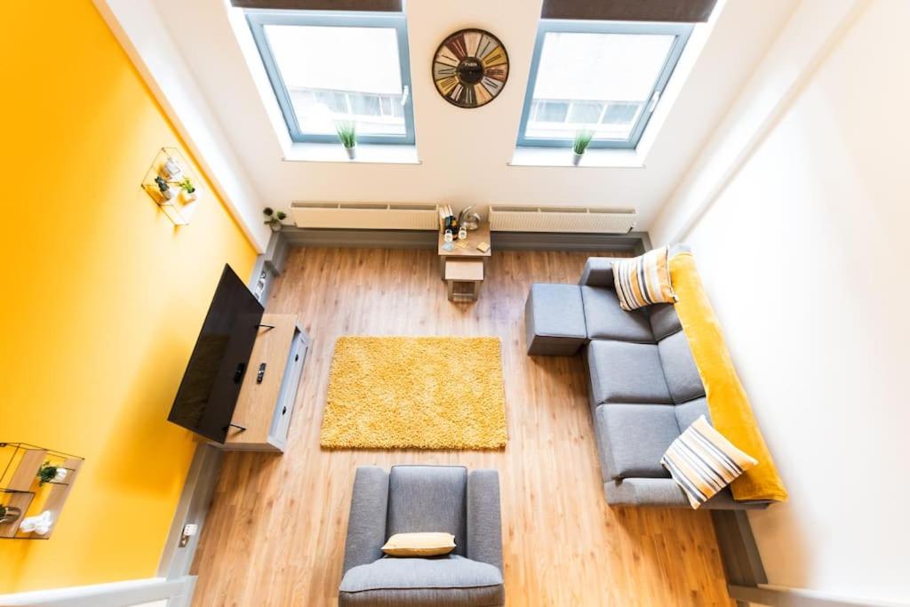 an overhead view of a living room with skylights at Crusader Apartment (Notts City Centre Central) in Nottingham