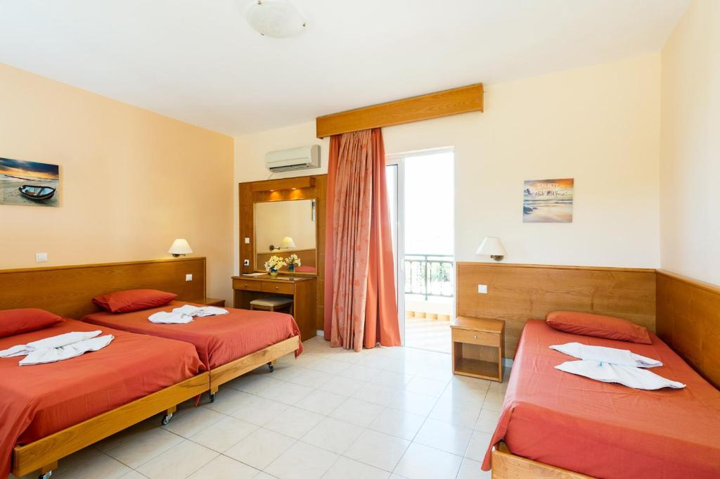 Postel nebo postele na pokoji v ubytování Summer Memories Aparthotel