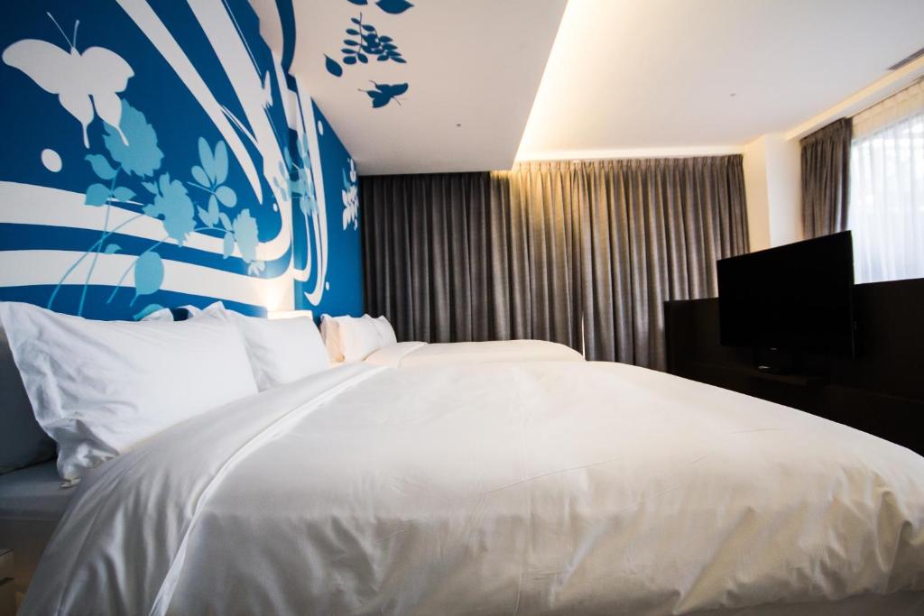 Postel nebo postele na pokoji v ubytování No. 9 Hotel