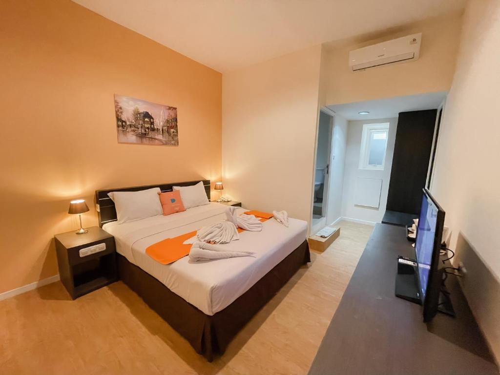 Postel nebo postele na pokoji v ubytování Sans Sunset Point Seminyak