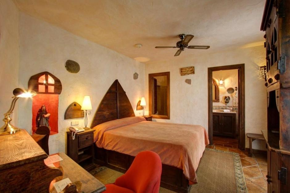 Postel nebo postele na pokoji v ubytování Hotel Amanhavis