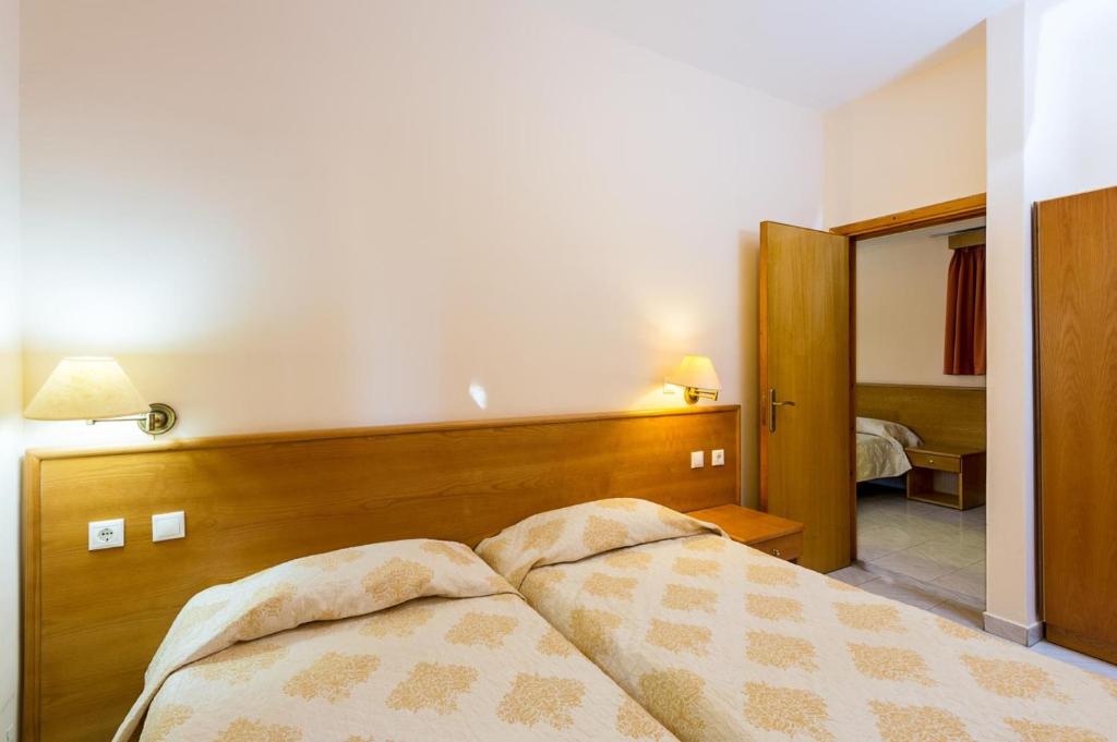 Postel nebo postele na pokoji v ubytování Summer Memories Aparthotel