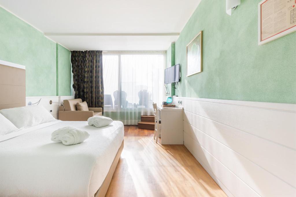 Postel nebo postele na pokoji v ubytování Hotel Gabry