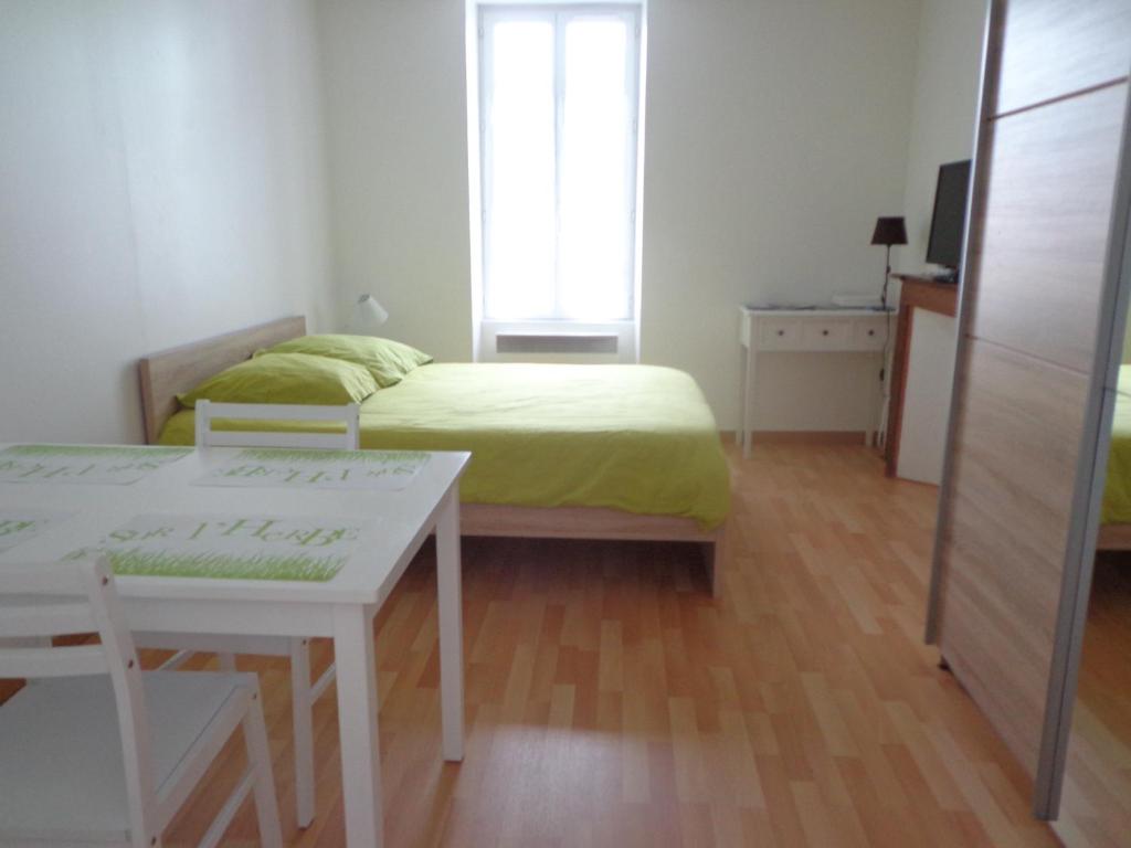 Ένα ή περισσότερα κρεβάτια σε δωμάτιο στο Appartement d'Hôtes