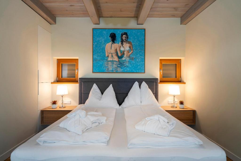 A bed or beds in a room at Stadl Niglberg Südsteiermark