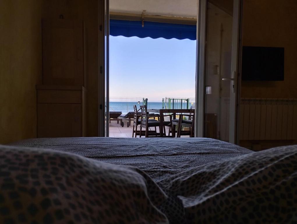 Postel nebo postele na pokoji v ubytování Le Surplage