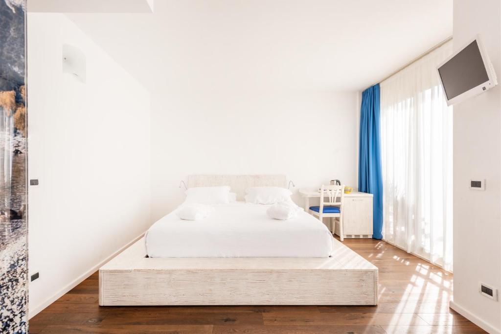 Postel nebo postele na pokoji v ubytování Hotel Gabry