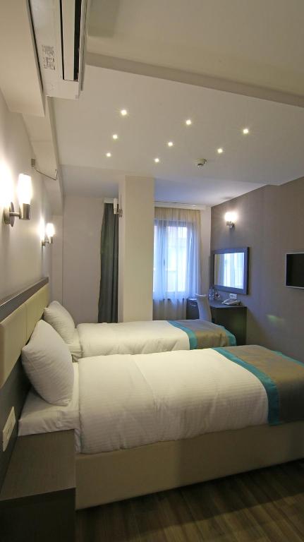 Postel nebo postele na pokoji v ubytování Hotel Vlaho