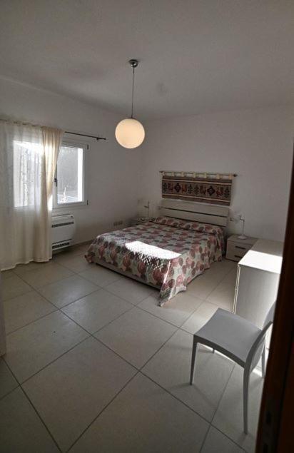 Postel nebo postele na pokoji v ubytování Portupaleddu Apartment