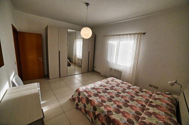 Postel nebo postele na pokoji v ubytování Portupaleddu Apartment