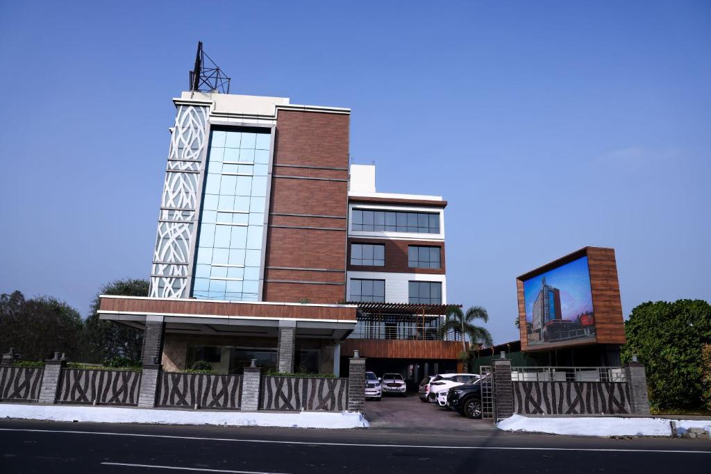 a building with a sign on the side of it at Anukulas Residency - Vellore in Vellore