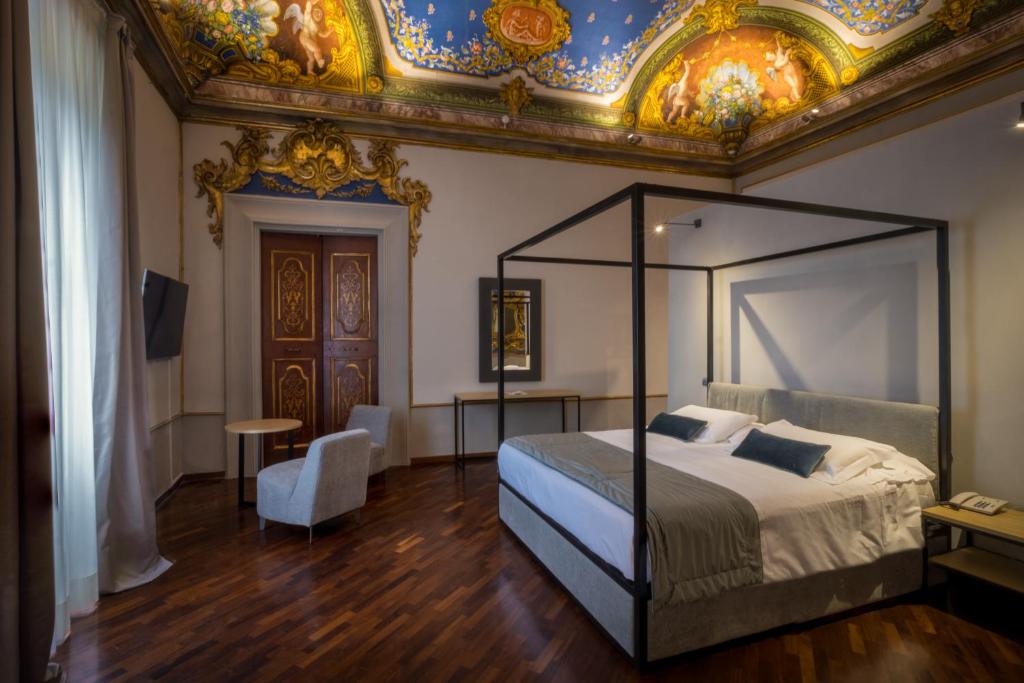 Postel nebo postele na pokoji v ubytování Bosone Palace