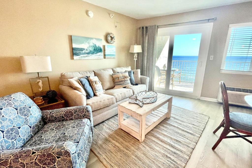 a living room with a couch and a table at Perdido Sky 72 in Perdido Key