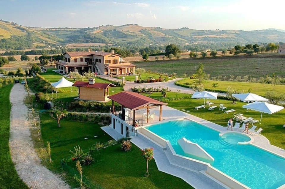 an aerial view of a villa with a swimming pool at Moresco Agriturismo in Moresco