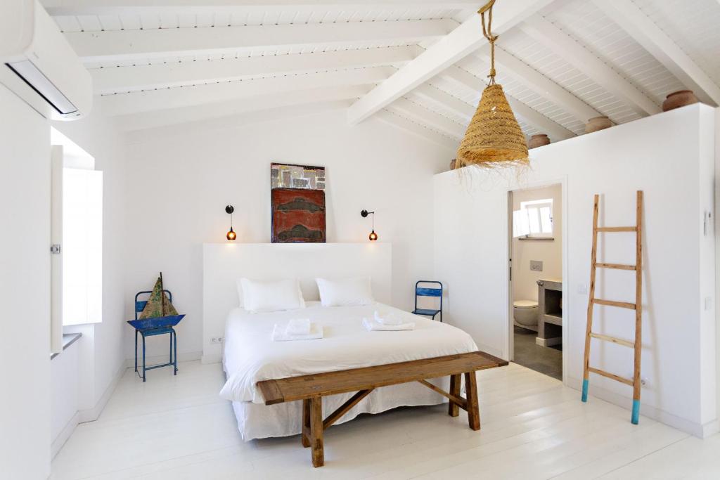 Postel nebo postele na pokoji v ubytování Casa da Tavira