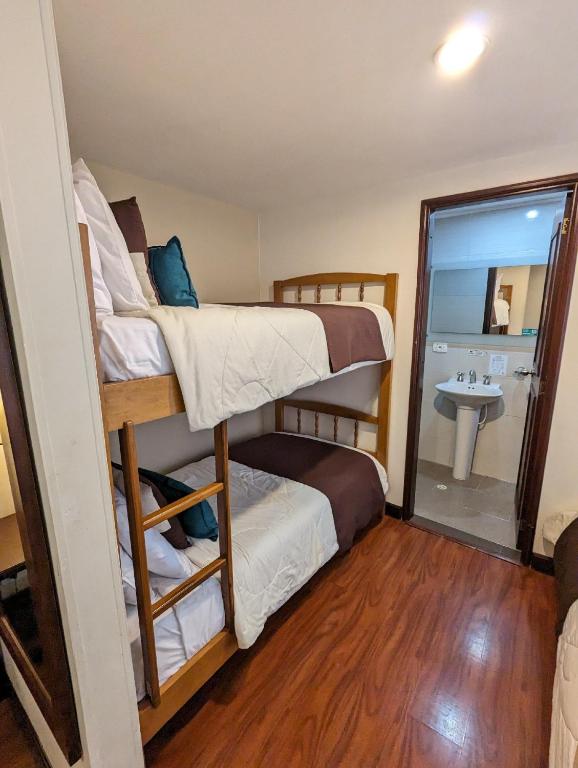 Postel nebo postele na pokoji v ubytování Hotel La Sabana