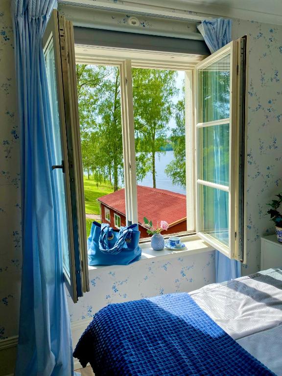 Postel nebo postele na pokoji v ubytování Villa Fryksta