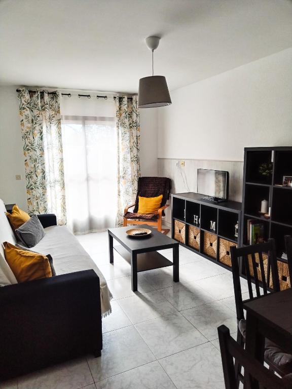 a living room with a couch and a table at CASA PURI in Candeleda