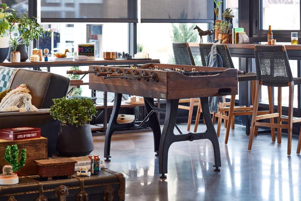 a wooden table with aoustic at MOXY Denver Cherry Creek in Denver