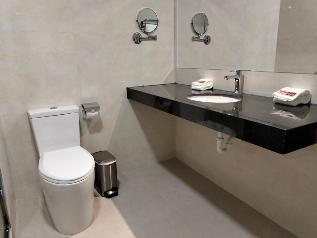 Koupelna v ubytování SM HOTEL Plus