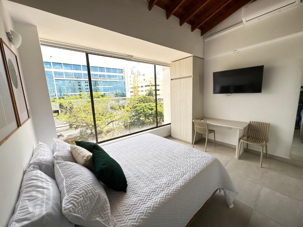 Postel nebo postele na pokoji v ubytování Magico Apartaestudio con Piscina 1 Habitacion PR39