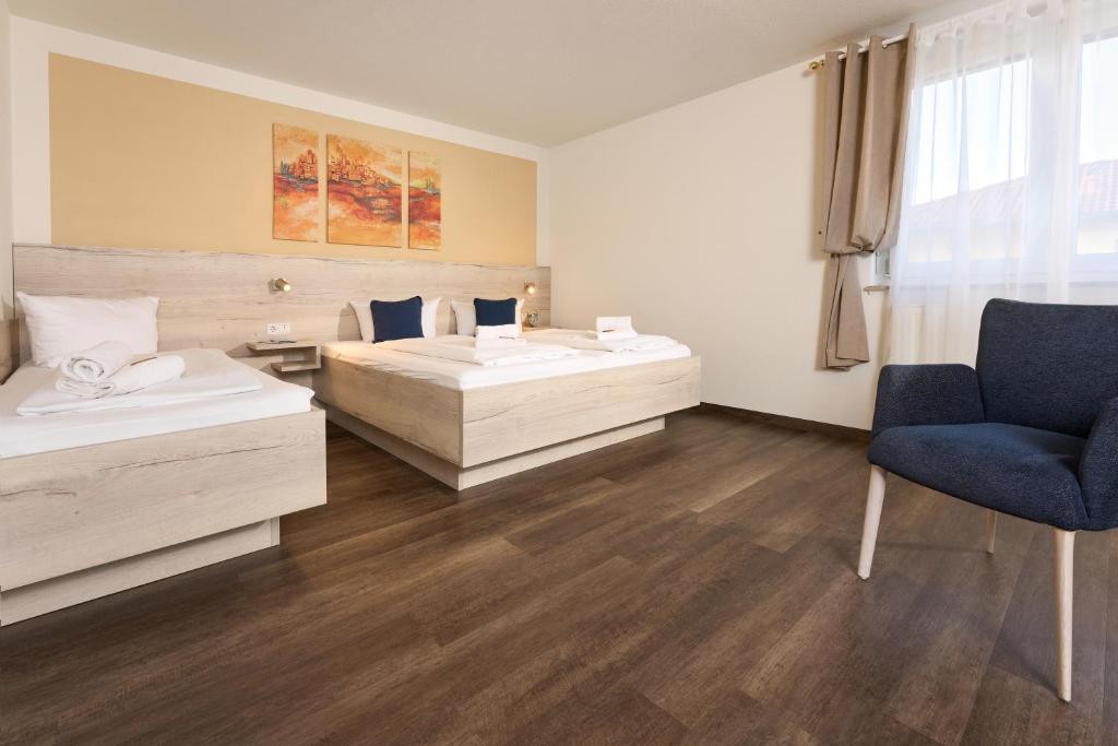 Postel nebo postele na pokoji v ubytování Hotel Apollon Rust