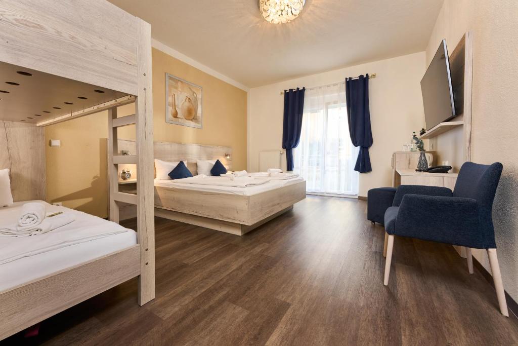 Postel nebo postele na pokoji v ubytování Hotel Apollon Rust