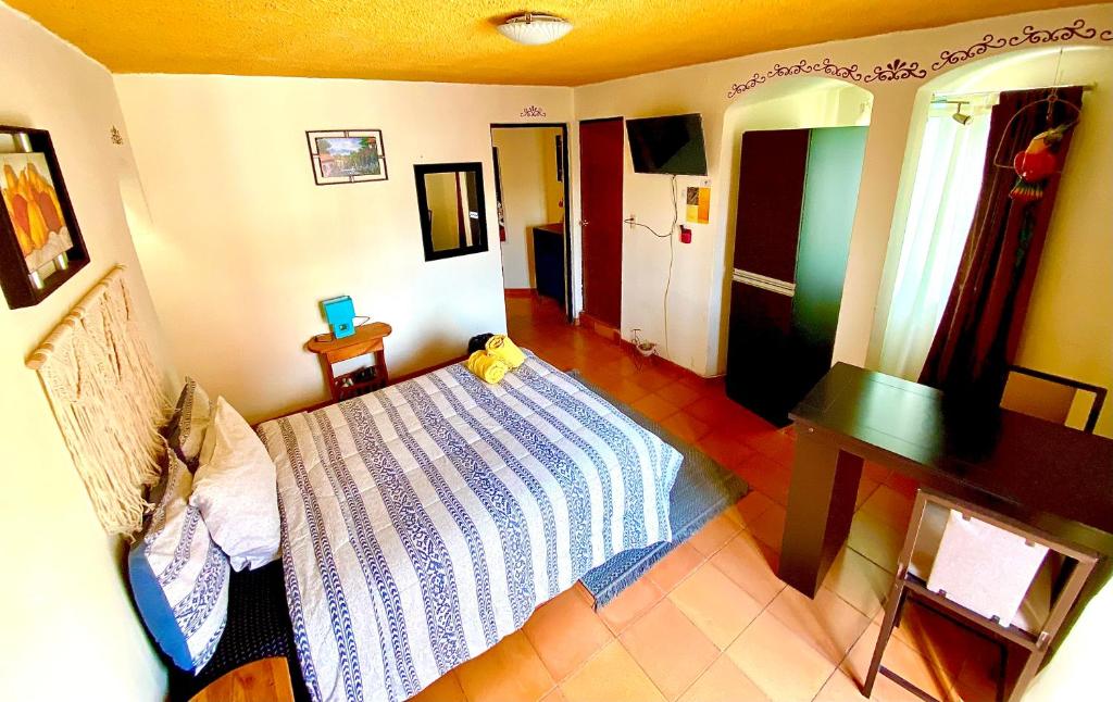 Postel nebo postele na pokoji v ubytování Casa Rofo