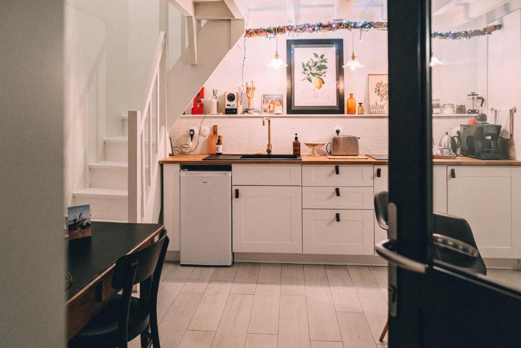Cuisine ou kitchenette dans l'établissement Le Citron