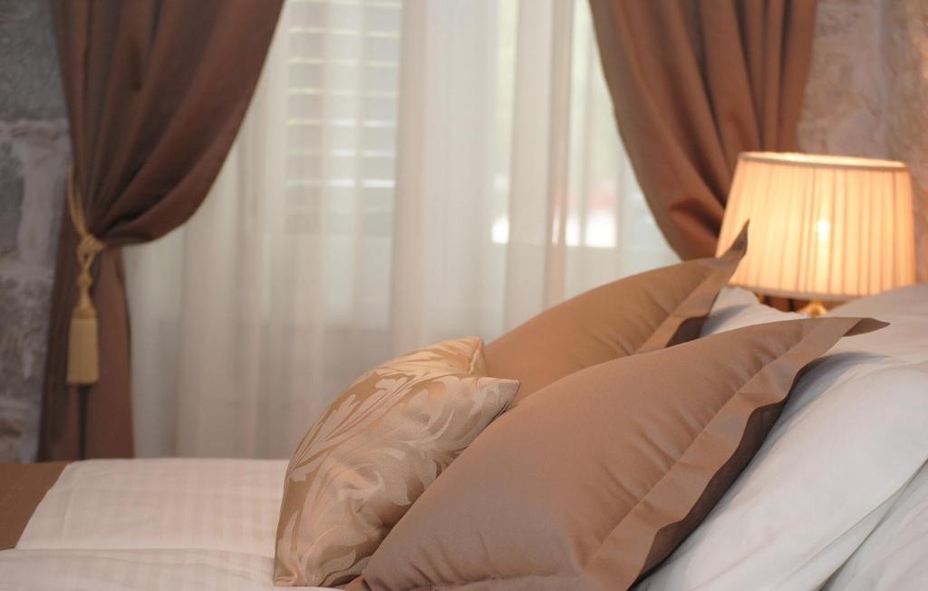 Postel nebo postele na pokoji v ubytování Lanterna Rooms