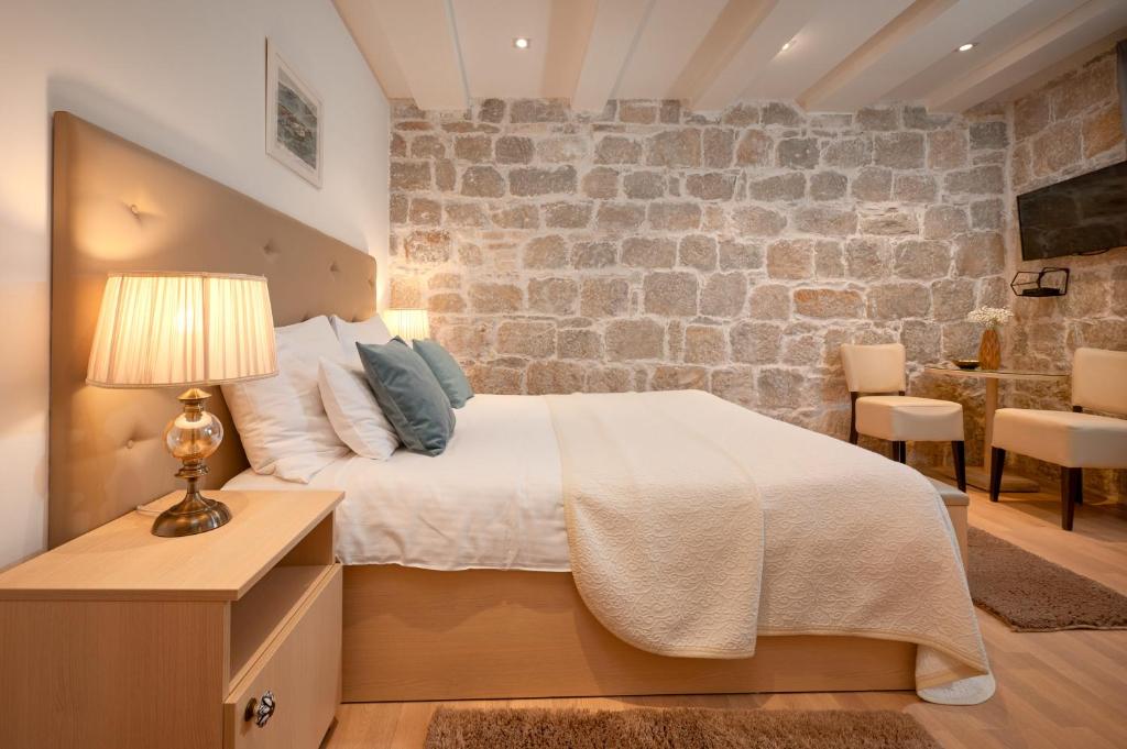 Postel nebo postele na pokoji v ubytování Lanterna Rooms